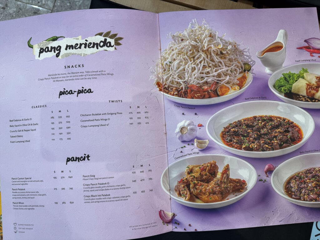The Manam menu page headed pang merienda showing pica-pica snacks and the pancit list with prices