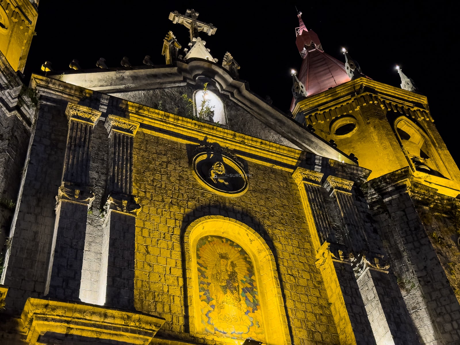 Illuminated facade of Molo Church in Iloilo City at night