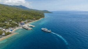Aerial view of Mainit Port in Oslob with a passenger ferry sailing toward Siquijor
