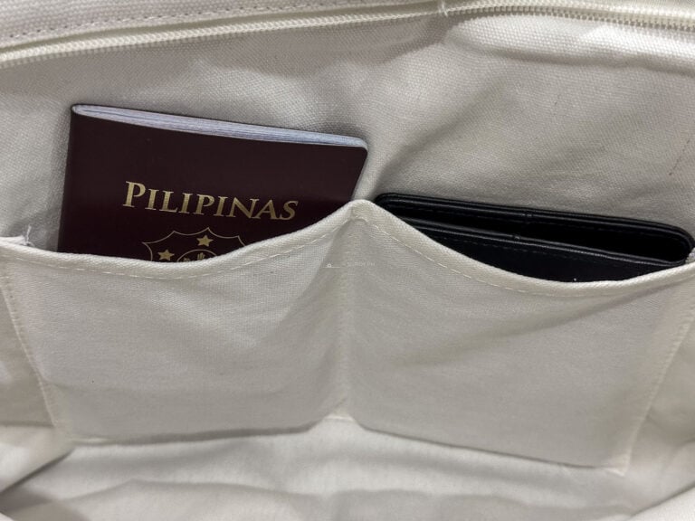 Philippine passport tucked inside a travel bag pocket
