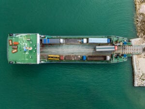 Aerial view of a RoRo ferry loaded with trucks at a Philippine port