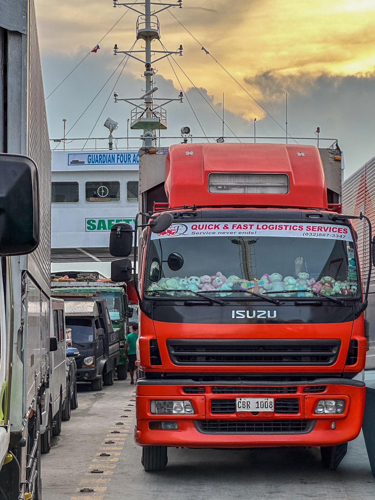 Cargo trucks lined up inside the vehicle deck of a RoRo ferry