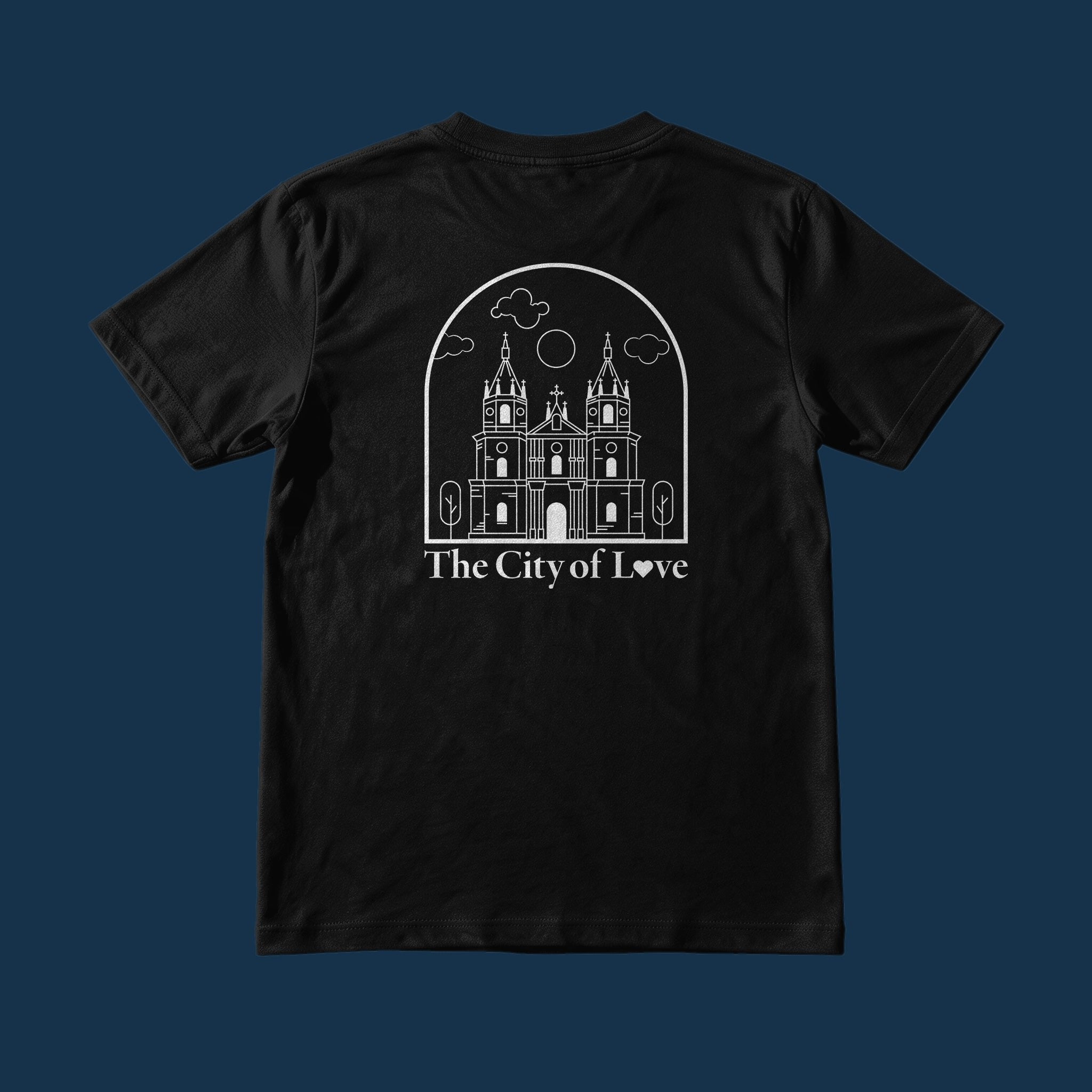 Suroy Wear Iloilo City of Love tee on a Reef Navy background, back print a line drawing of Molo Church