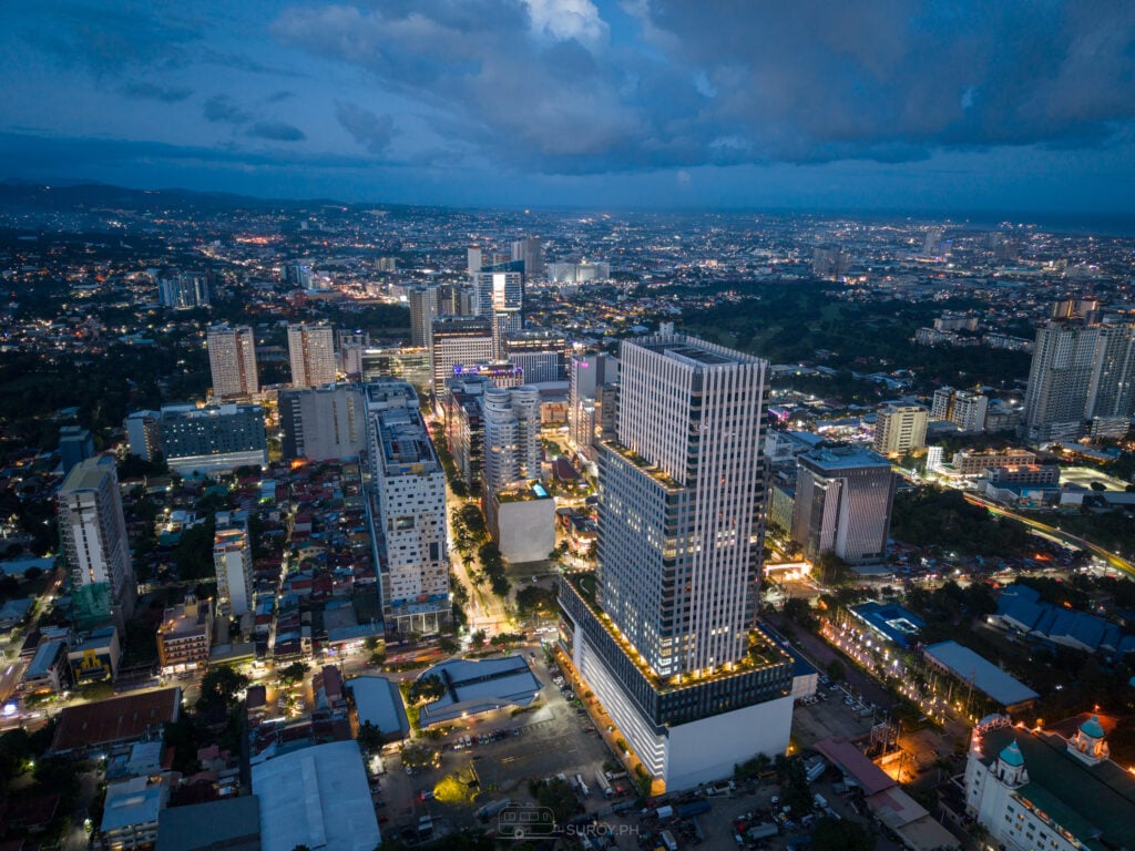 Cebu Exchange tower beside Cebu IT Park at blue hour, seen from the air
