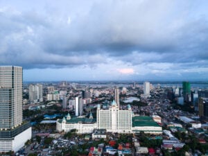 Aerial view of Waterfront Cebu City Hotel and Casino with Cebu City behind it