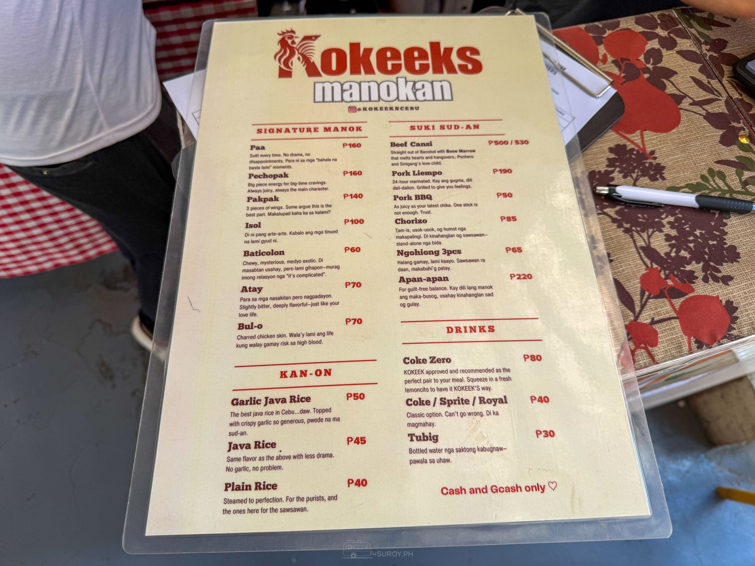 Kokeek's Manokan menu listing signature manok cuts from paa to baticolon, suki sud-an including beef cansi, rice and drinks